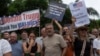 White South Africans demonstrate in support of U.S. President Donald Trump in front of the U.S. embassy in Pretoria, South Africa, Saturday, Feb. 15, 2025. (AP Photo/Jerome Delay)