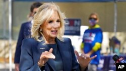 FILE - Jill Biden speaks to reporters while campaigning for her husband, then-Democratic presidential candidate Joe Biden, in St. Petersburg, Fla., Nov. 3, 2020.