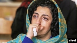 An undated photo of Narges Mohammadi, an Iranian journalist who has "serious health problems," her brother says, but is not allowed out of prison to see a doctor. (Courtesy RFE/RL)