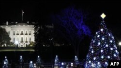 The National Christmas Tree is pictured with the White House in the background after it was lit on the Ellipse across from the White House in Washington, Thursday, Dec., 1, 2011