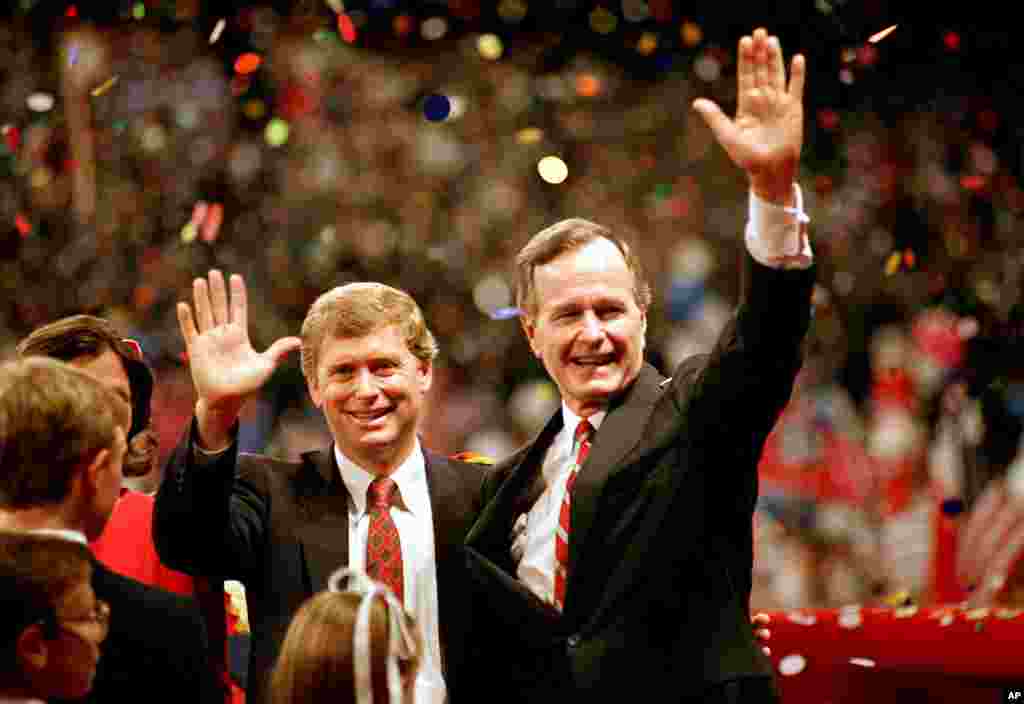 FILE - Vice President George Bush and his running mate, Indiana Sen. Dan Quayle, wave to the assembly of the Republican National Convention in New Orleans, Aug. 18, 1988. Bush and Quayle were nominated as presidential and vice presidential candidates, respectively.