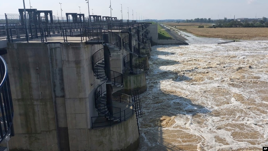 This photo provided by the state company Polish Waters shows the Oder River flood waters channeled into the newly-built Lower Raciborz Reservoir in Raciborz, southwestern Poland, Sept. 23, 2024. (Polish Waters via AP)