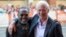 Richard Gere (R) hugs Ben Vereen as they arrive for the "Time Out of Mind" gala at the Toronto International Film Festival (TIFF) in Toronto, Canada, Sept. 7, 2014.