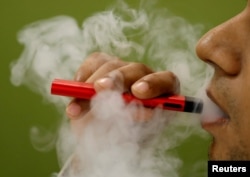 FILE - So far, investigators have not identified a particular device, liquid or ingredient behind the U.S. outbreak of severe vaping-related illnesses.