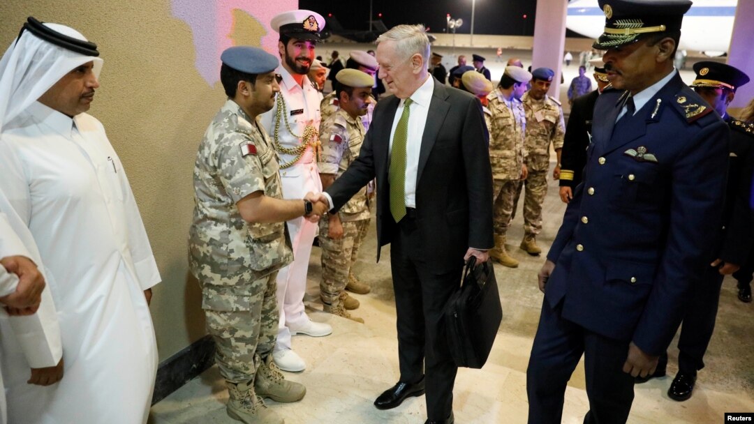 FILE - U.S. Defense Secretary James Mattis, center, is greeted by military dignitaries as he arrives at Al-Udeid Air Base in Doha, Qatar, April 21, 2017.