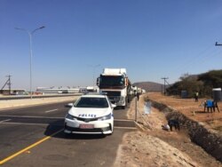 Botswana police escort all trucks entering the country from South Africa. (Mqondisi Dube/VOA)