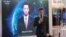 Xinhua news anchor Qiu Hao stands next to an AI virtual news anchor based on him, at a Sogou booth during an expo at the fifth World Internet Conference in Wuzhen town of Jiaxing, Zhejiang province, China, Nov. 7, 2018.