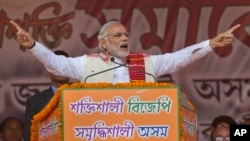 Indian Prime Minister Narendra Modi addresses a youth rally organized by the Bharatiya Janata Party ahead of Assam state elections in Gauhati, India, Jan. 19, 2016. 