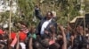 FILE - Opposition Malawi Congress Party leader Lazarus Chakwera addresses the protesters in Blantyre, July 25, 2019, where he said he would not relent until justice is done. (VOA/L.Masina)