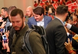 Liberal leader and Canadian Prime Minister Justin Trudeau wears a protective vest amid heavy security as he attends an election campaign rally in Mississauga, Ontario, Canada, Oct. 12, 2019.
