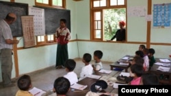 Students at the Nan Ouw School in Burma recite the Burmese and English alphabet for "Build a School in Burma" founder Bob Cornwell. (Courtesy Build a School in Burma) 