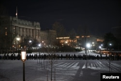 Members of the public line up near the Visitor Center entrance to view the flag-draped casket of former U.S. President Jimmy Carter, as he lies in state in the U.S. Capitol Rotunda in Washington, Jan. 8, 2025.