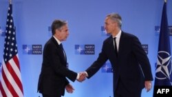 US Secretary of State Antony Blinken (L) and Secretary General of NATO Jens Stoltenberg shake hands after they delivered a joint statement during a NATO foreign ministers meeting at NATO headquarters in Brussels, on November 28, 2023. (Photo by SIMON WOHL