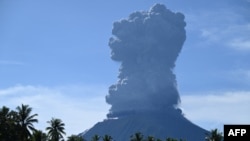 This handout photo taken and released by the Center for Volcanology and Geological Hazard Mitigation on May 13, 2024 shows Mount Ibu spewing thick smoke in Indonesia's North Maluku Province.