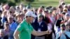 Danny Willett, of England, celebrates on the 18th hole after finishing the final round of the Masters golf tournament Sunday, April 10, 2016, in Augusta, Georgia. 