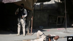 FILE —A police aims during clashes with gang members in Port-au-Prince, Haiti, Friday, March 1, 2024.