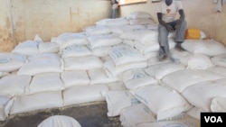 Bags of maize ready for distribution at Dzaleka refugee camp in Malawi (photo taken by Lameck Masina).