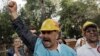 Turkish miners shout anti-government slogans during forum on the first anniversary of last year's massive anti-government protests, Ankara, May 31, 2014.