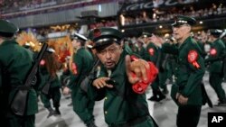 FILE - Performers from the Salgueiro samba school parade during Carnival celebrations at the Sambadrome in Rio de Janeiro, Brazil, February 12, 2024.