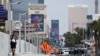 Heat waves cause distortion on the horizon as a pedestrian walks along South Las Vegas Blvd in Las Vegas, Nevada, on July 30, 2023, as temperatures reach more than 100 degrees Fahrenheit (37.78C).