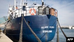 FILE - This photo shows the Sea Eye rescue ship Alan Kurdi during its inauguration in Palma de Mallorca, Feb. 10, 2019.