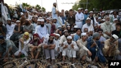 FILE - Sunni Muslims attend an anti-Shiite protest in Islamabad, Sept. 17, 2020. Such rallies followed a raft of blasphemy accusations against Shiite leaders in Sunni-majority Pakistan. 