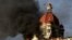 Flames gush from Taj Mahal Palace hotel during a terror attack that claimed 166 in Mumbai, Nov. 27, 2008.