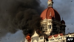 Flames engulf the Taj Mahal Hotel in Mumbai, on November 27, 2008.