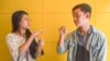 Seng Theary (left) talk to her colleague, Phem Vengheng, who has a hearing disability, using sign language at their workplace, Socials Coffee, in Phnom Penh, Cambodia, May 23, 2020. (Hean Socheata/VOA Khmer)