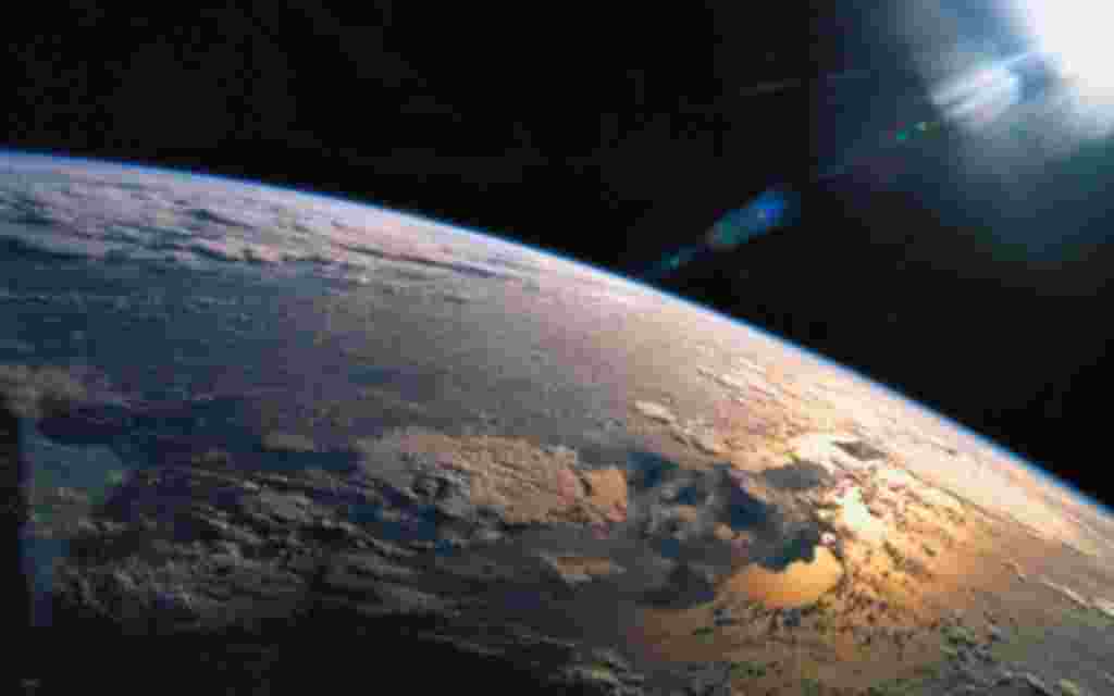 view from space of the suns rays falling on earth
