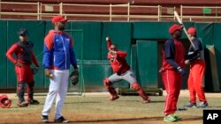 Members of the Cuba's national baseball team take part in a training session in San Jose de las Lajas, Mayabeque province, Cuba, March 17, 2016.