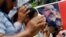 Supporters of Egypt's ousted President Mohammed Morsi pray in front of his poster, Cairo, July 12, 2013.