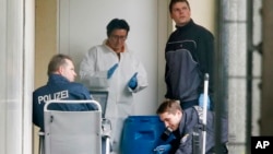 German police secure evidence in front of an apartment in Oberursel, Germany, April 30, 2015. 