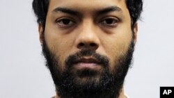 This undated photo released by the Ministry of Home Affairs shows Rahman Mizanur, one of four Bangladeshi men convicted in a Singapore Court on Tuesday, May 31, 2016.