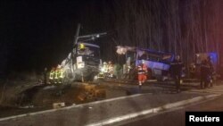 Rescue workers are seen on the site of collision between train and school bus in Millas, France, Dec. 14, 2017, in this handout picture from France Bleu Roussillon.