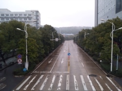 FILE - An empty street is seen in Wuhan, Hubei province, China, Jan. 25, 2020, in this picture obtained from social media.