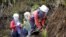 FILE - Mine detectors are used to search for landmines in Antioquia province, Colombia, Nov. 19, 2015.