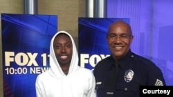 Sergeant Keith Mott with a student he mentored through Big Brothers Big Sisters of America for almost five years. He took the student to Fox Studios just before he graduated from high school. 