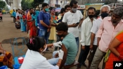 A man receives the vaccine for COVID-19 during a vaccination drive in Ahmedabad, India, Aug. 31, 2021. 