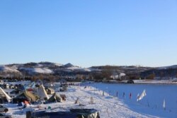 FILE - Thousands of Native Americans, activists, and their supporters came to the Standing Rock reservation North Dakota in 2016 to protest construction of the pipeline. (Esha Sarai/VOA)