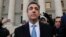Michael Cohen walks out of federal court in New York, Nov. 29, 2018, after pleading guilty to lying to Congress about work he did on an aborted project to build a Trump Tower in Russia. Cohen told the judge he lied about the timing of the negotiations.