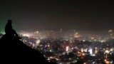 In this late Nov.3, 2013 photograph, a man watches Diwali fireworks light up the night sky above Ajmer, Rajasthan state, India. Millions of Indians were setting off deafening fireworks displays to light up the sky for Diwali, the Hindu Festival of Lights.
