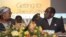 Zimbabwean Deputy Prime Minister Khupe, left, chats with President Mugabe at a women's empowerment event, Harare, May 24,2012.