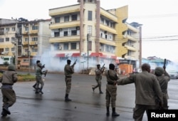 Police fire tear gas during a nationwide strike called by Mozambique presidential candidate Venancio Mondlane to protest the provisional results of an Oct. 9 election, in Maputo, Mozambique, Oct. 21, 2024.