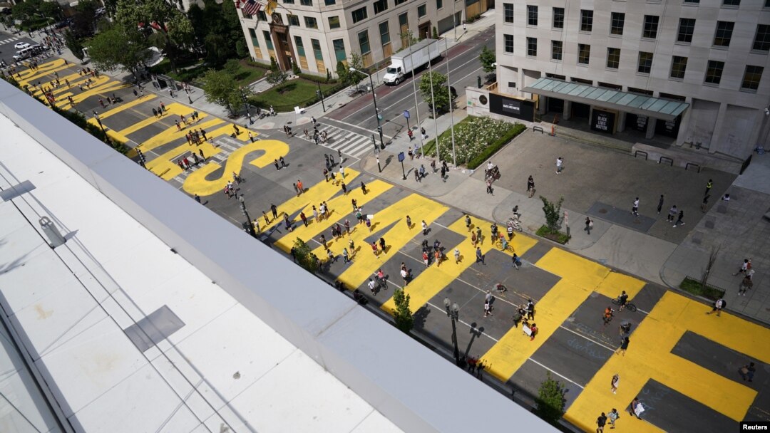 "Black Lives Matter" is painted on 16th Street near the White House as protests against the death in Minneapolis police custody of George Floyd continue in Washington, June 5, 2020. 