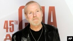 FILE - Singer Gregg Allman arrives at the 45th Annual CMA Awards in Nashville, Tennessee, Nov. 9, 2011. 