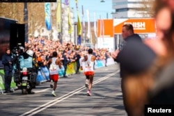FILE - Dutch runner Abdi Nageeye (number 9) wears a CGM (continuous glucose monitor) on his upper left arm as he competes in the 2022 Rotterdam marathon, in Rotterdam, Netherlands, April 2022. NN (Running Team/Handout via REUTERS)