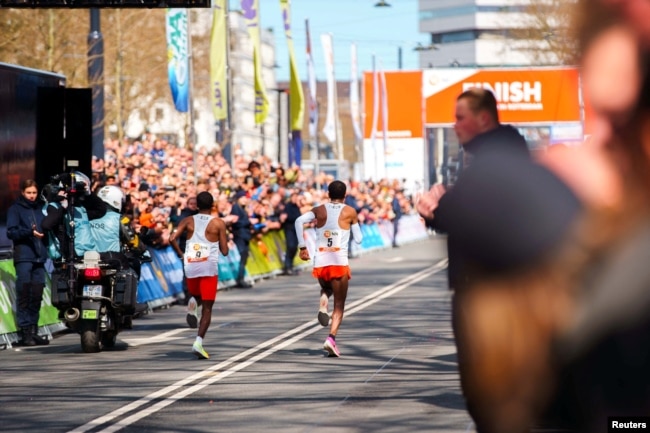 FILE - Dutch runner Abdi Nageeye (number 9) wears a CGM (continuous glucose monitor) on his upper left arm as he competes in the 2022 Rotterdam marathon, in Rotterdam, Netherlands, April 2022. NN (Running Team/Handout via REUTERS)