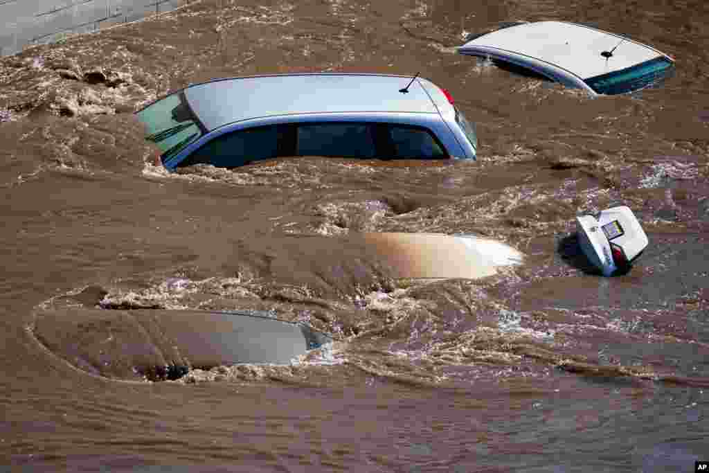 Vehicles are under floodwater from the Schuylkill River in the Manayunk section of Philadelphia, in the aftermath of downpours and high winds from the remnants of Hurricane Ida that hit the area.