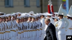 Russian President Vladimir Putin arrives to attend the military parade during the Navy Day celebration in St.Petersburg, Russia, July 26, 2020.